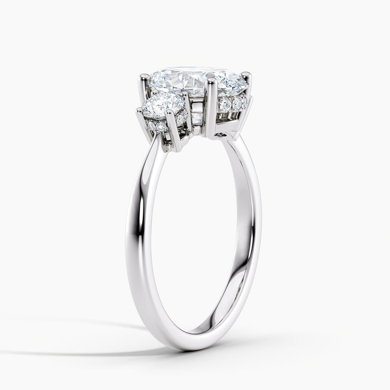 Tapered Three Stone Oval Diamond Hidden Halo Engagement Ring