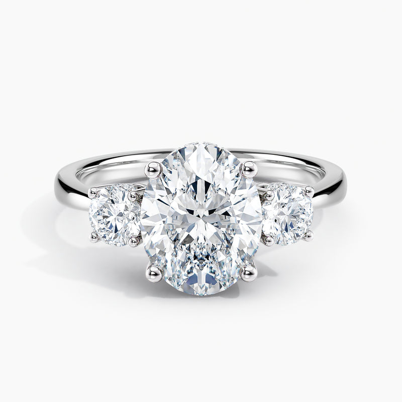 Tapered Three Stone Oval Diamond Hidden Halo Engagement Ring