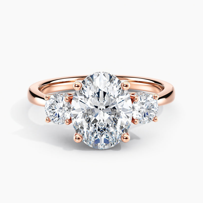 Tapered Three Stone Oval Diamond Hidden Halo Engagement Ring